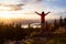 Adventure Girl on top of a Mountain with Canadian Nature Landscape