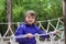 Adventure little girl on jungle park rope bridge