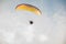 Adventure man active extreme sport pilot flying in sky with paramotor engine glider parachute.