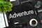 Adventure - Text on Black Chalkboard. 3D Rendering.