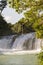 Adventure Traveller Jumping Off Waterfall In Belize