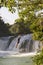 Adventure Traveller Jumping Off Waterfall In Belize