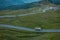 Adventure truck or overlanding vehicle on route over the passo giovo or jaufenpass on a summer evening