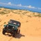 Adventure in Vietnam Jeep car on Mui Ne sand dunes