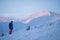 Adventurer, with backpack, stands on the mountain range