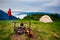 Adventurer relaxes in the camp next to the bonfire