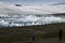 Adventurers viewing glacier