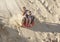 Adventuresome girls boarding down the Sand Dunes