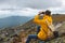 Adventurous active ambitious man looking through binoculars