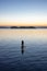 Adventurous Caucasian Adult Woman on a Stand Up Paddle Board