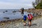 Adventurous girl hiking Juan de Fuca Trail to Bear Beach on the Pacific Ocean Coast