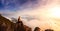 Adventurous Girl Hiking on top of a Rocky Mountain Cliff