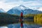 Adventurous Girl Paddle Boarding on Levette Lak