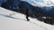 Adventurous Girl Snowshoeing in the snow on top of a mountain