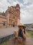 Adventurous girl with a yellow hat taking photos with her smartphone in the Magico town of Tlalpujahua, MichoacÃ¡n