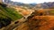 Adventurous hiker in the colorful mountains of Landmannalaugar