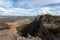 Adventurous hiker explorer reaching the top slab of Donkey Mountain