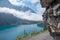 Adventurous hiking trail above lake Oeschinensee, under overhanging rocks