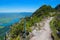 Adventurous hiking trail at the mountain ridge herzogstand with safety rope