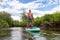 Adventurous Hispanic Adult Athletic Man paddle boarding