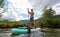 Adventurous Hispanic Adult Athletic Man paddle boarding