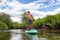 Adventurous Hispanic Adult Athletic Man paddle boarding