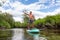 Adventurous Hispanic Adult Athletic Man paddle boarding