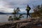 Adventurous Latino Male is Trail Running outdoors in Canadian Nature