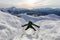 Adventurous man Climbing up a steep snowy mountain