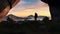 Adventurous Man Hiker standing in a cave. River and Mountains in background. 3d Rendering.