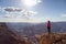 Adventurous Traveler standing on Desert Rocky Mountain American Landscape