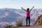 Adventurous Traveler standing on Desert Rocky Mountain American Landscape