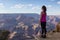 Adventurous Traveler standing on Desert Rocky Mountain American Landscape