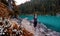 Adventurous White Caucasin Adult Woman Hiking on a trail in Canadian Nature