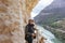 Adventurous woman with helmet taking pictures on her holidays