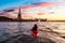 Adventurous Woman Sea Kayaking near the Statue of Liberty