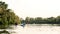 Adventurous young people boating on a lake surrounded by peaceful nature