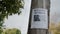 An advertisement for the missing woman hangs on a wooden pole. Search for missing people