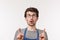 Advertisement, small business and career concept. Close-up portrait of curious and intrigued caucasian man in apron and