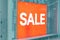 Advertising signboard inscription sale orange color in store in mall
