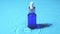 Advertising slow motion, Glass cosmetic bottle with pipette lies on the surface of the water. Top view of drop falls into water