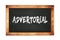 ADVERTORIAL text written on wooden frame school blackboard