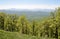 Adygea, mountain landscape in spring. In the background of the main Caucasian ridge