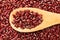 Adzuki Bean legume. Grains in wooden spoon. Close up.