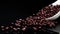 Adzuki beans on white porcelain spoon on black background, organic beans