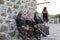 Aegean area - old villager women sitting at the wind mill