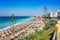 Aegean beach with sunshades in city of Rhodes Rhodes, Greece