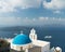 Aegean sea with view to Virgin Mary Catholic Church Three Bells of Fira, Santorini.