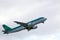 An Aer Lingus airplane takes off at Cork International Airport on a cloudy day