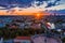 Aerail shot of the Lithuanian flag over the old town of Vilnius during the  sunset